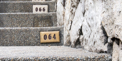 Numbered steps leading towards the lighthouse