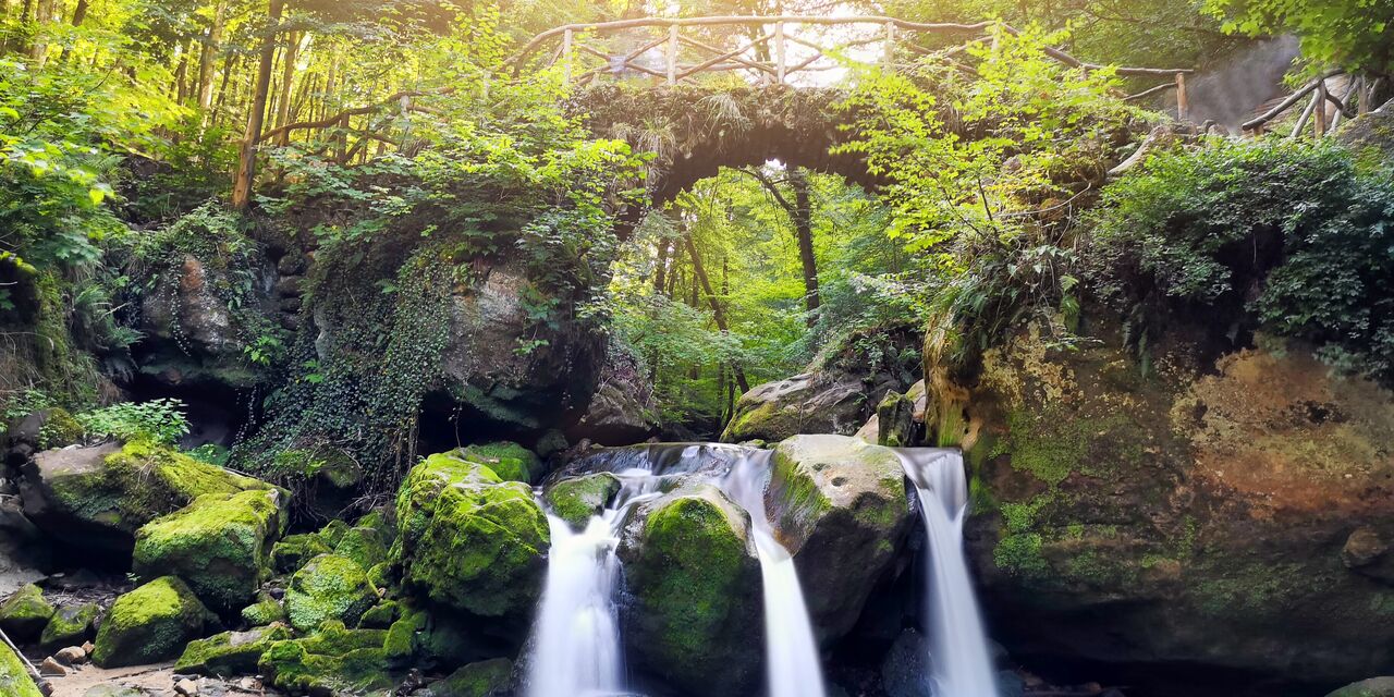 The Schiessentümpel waterfall in Müllerthal, Luxembourg