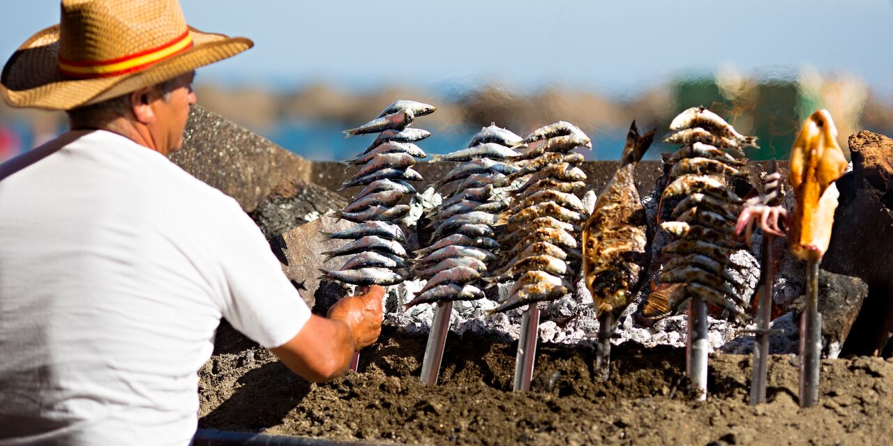 Espetos de sardines on the beach