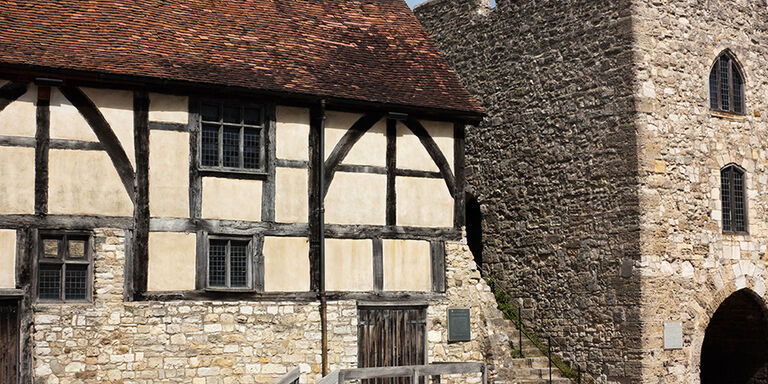 A section of city wall and a 14th-century merchant home