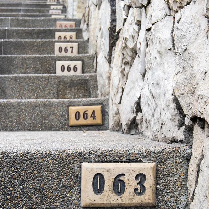 Numbered steps leading towards the lighthouse
