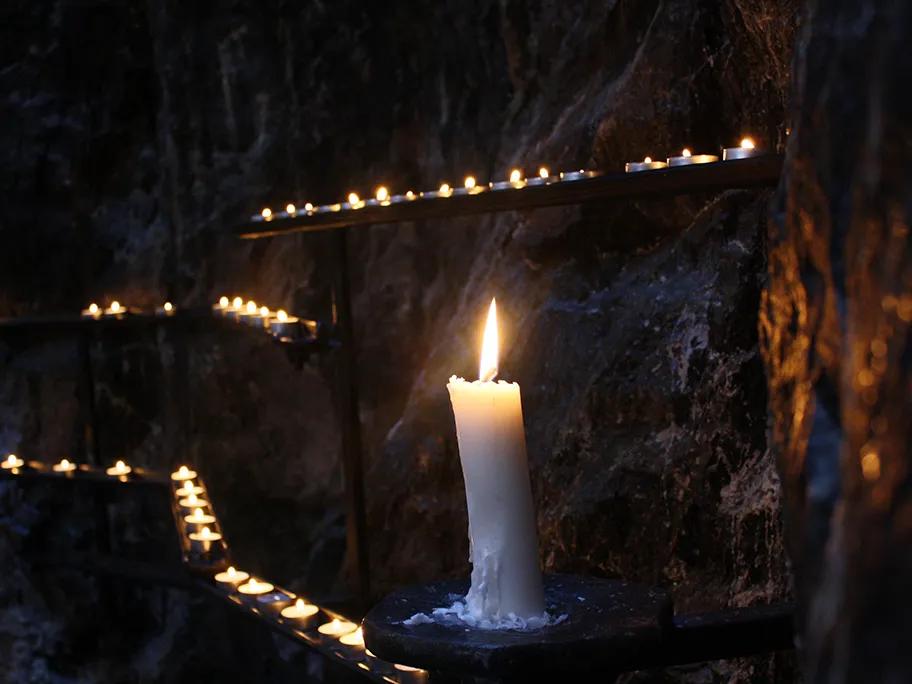 Candles along the rock walls
