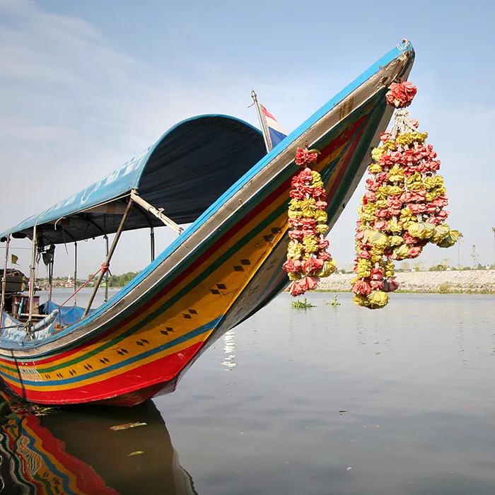 Travel by boat to the market and temple