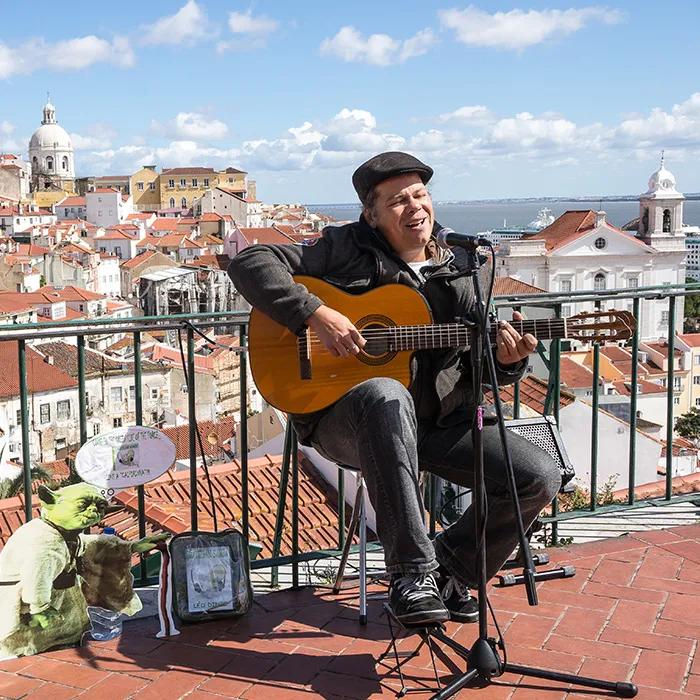Singer with Alfama in the background